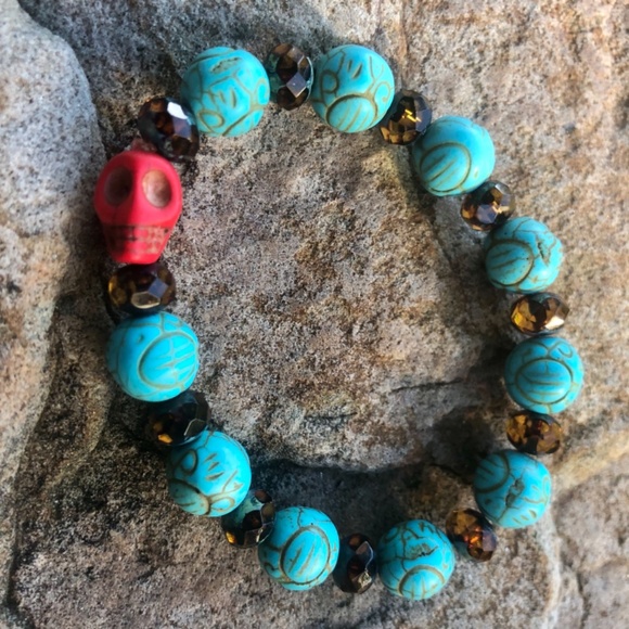 FREE with a $25 Purchase or More! Turquoise colored round beads with red scull - Picture 2 of 2